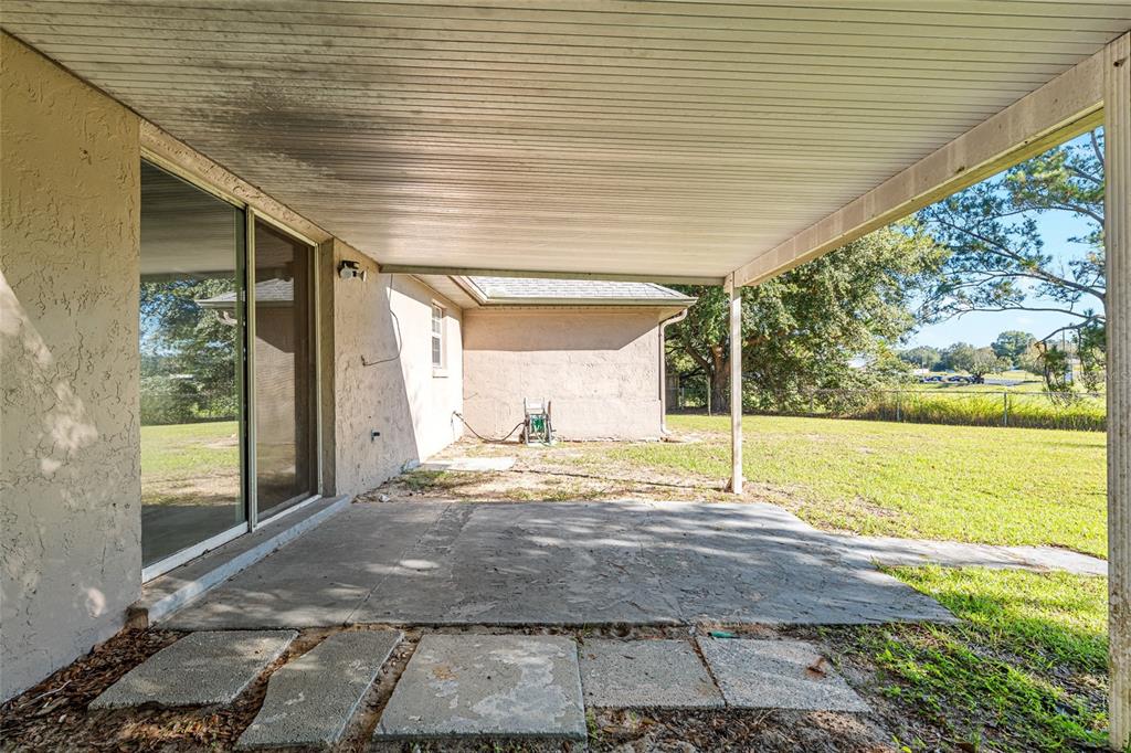21 Pecan Course Circle Ocala, FL 34472 - Photo 39 of 46 a view of a backyard of the house