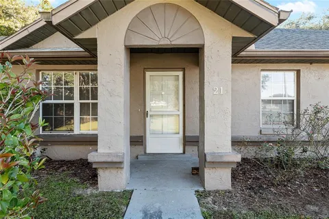 a front view of house with an outdoor space