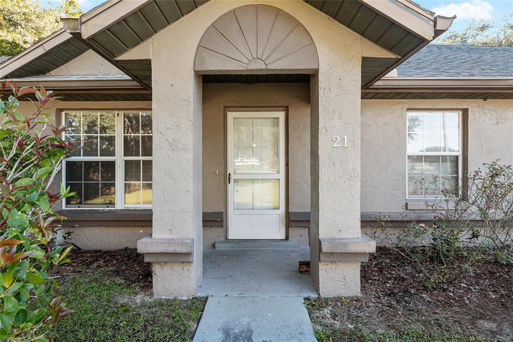 21 Pecan Course Circle Ocala, FL 34472 - Photo 4 of 46 a front view of house with an outdoor space