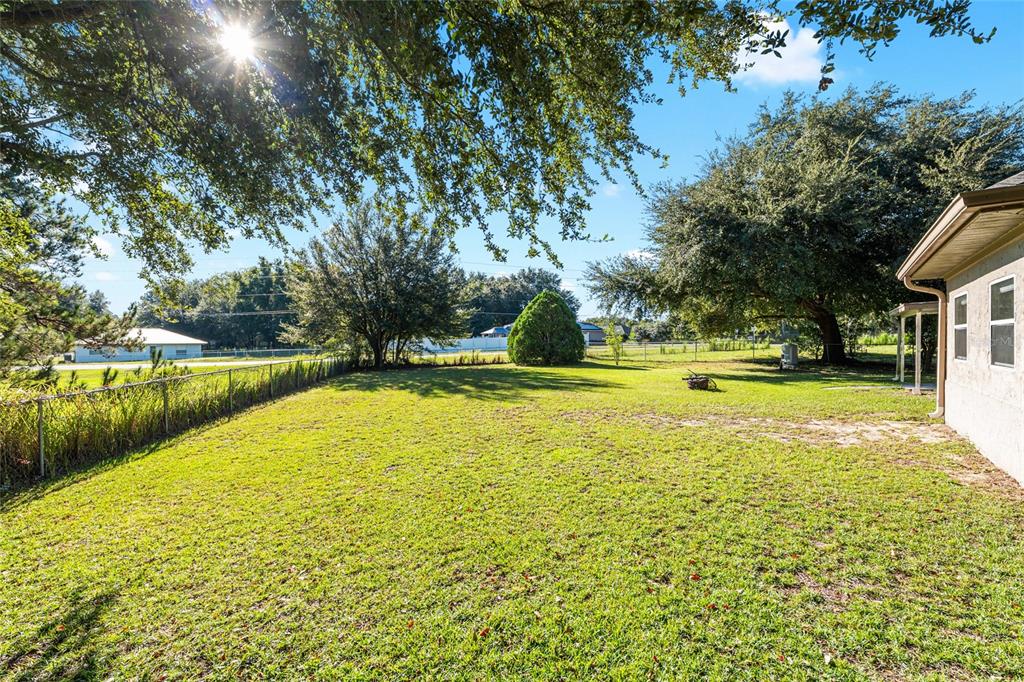 21 Pecan Course Circle Ocala, FL 34472 - Photo 42 of 46 a view of swimming pool with yard and lake view