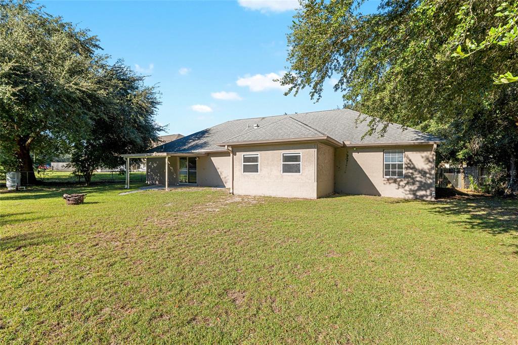 21 Pecan Course Circle Ocala, FL 34472 - Photo 43 of 46 a front view of a house with a garden