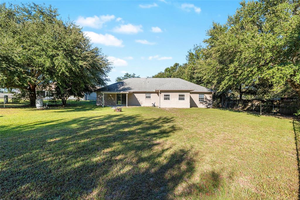 21 Pecan Course Circle Ocala, FL 34472 - Photo 44 of 46 a front view of house with yard and green space
