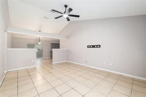 a view of a livingroom with a dishwasher cabinets and window