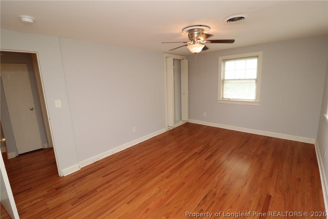 1000 Nichols Drive Raleigh, NC 27605 - Photo 16 of 22 wooden floor in an empty room with a window