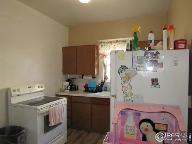 a utility room with sink dryer and washer