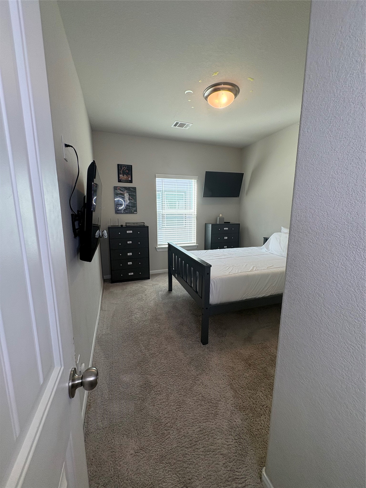 1239 Marvista Lane Rosharon, TX 77583 - Photo 30 of 50 a bedroom with a bed and a view of en suite bathroom