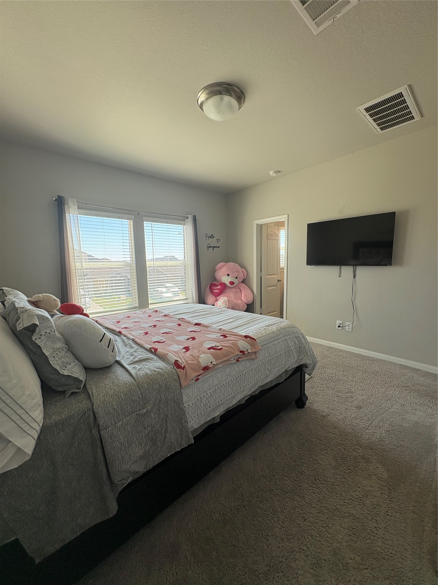 1239 Marvista Lane Rosharon, TX 77583 - Photo 42 of 50 a bedroom with a bed and a flat tv screen on dresser