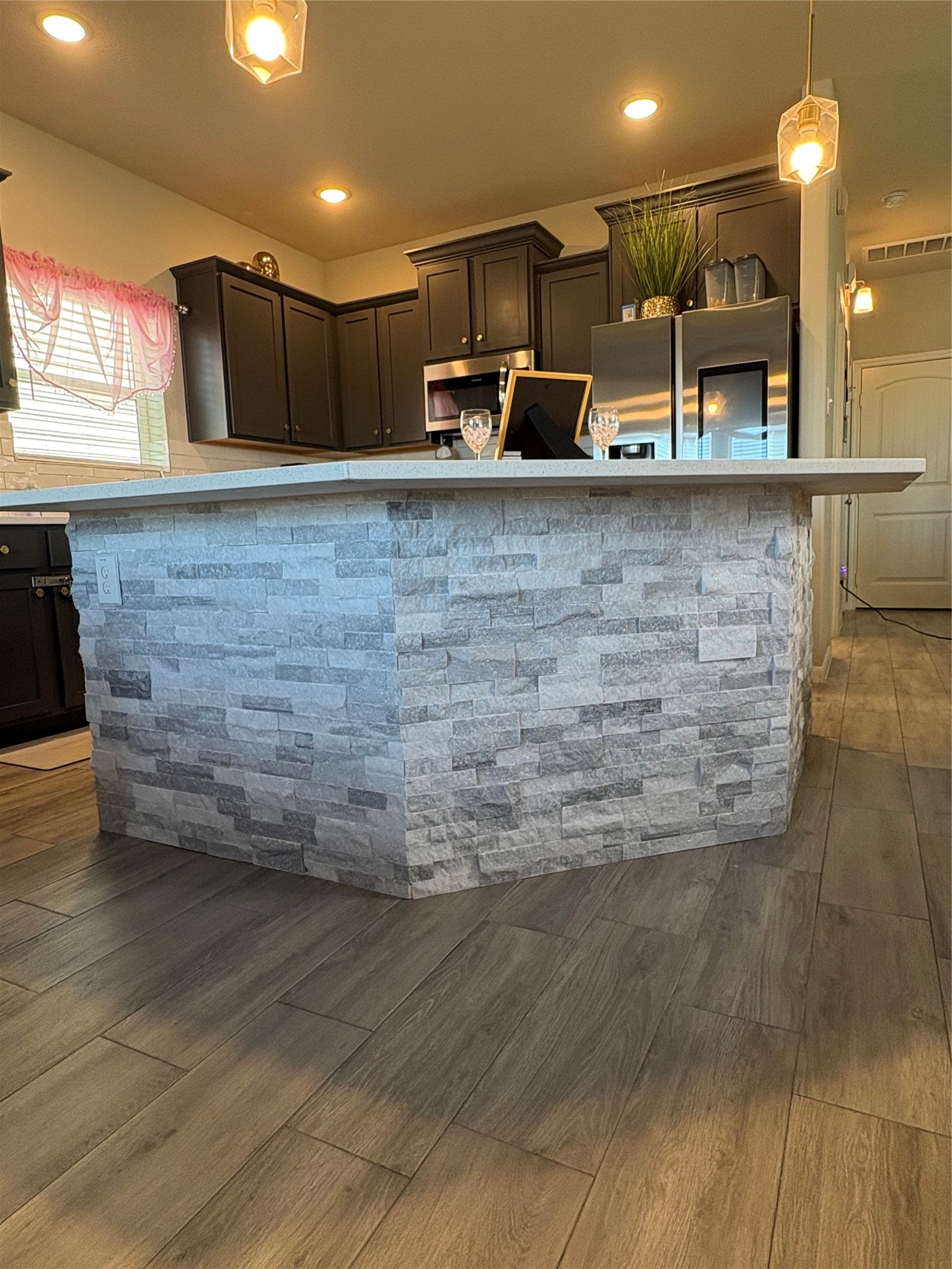 1239 Marvista Lane Rosharon, TX 77583 - Photo 7 of 50 a view of a kitchen with kitchen island a counter top space a sink and appliances