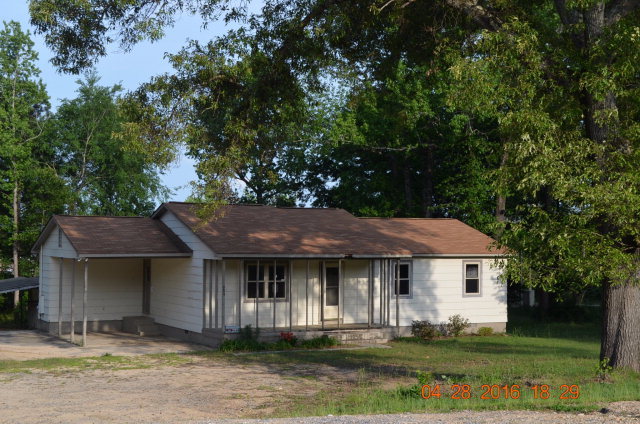 4684 Fulton Mill Road Macon, GA 31216 - Photo 2 of 16 a front view of a house with a yard