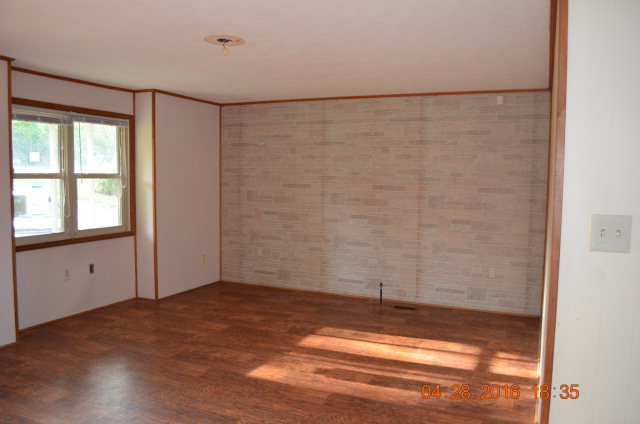4684 Fulton Mill Road Macon, GA 31216 - Photo 4 of 16 a view of empty room with wooden floor and fan