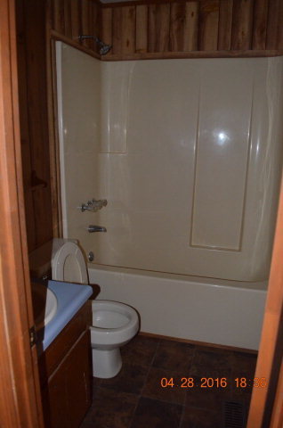 4684 Fulton Mill Road Macon, GA 31216 - Photo 8 of 16 a bathroom with a toilet and a shower