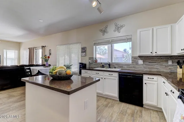 a kitchen with sink cabinets and window