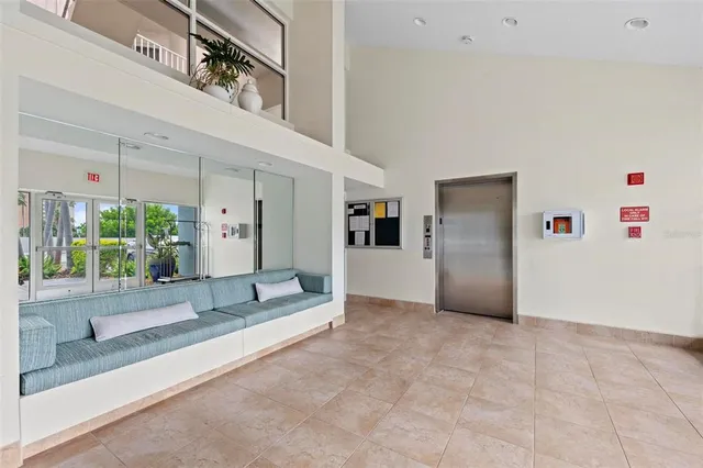 a patio with a table and chairs under an umbrella