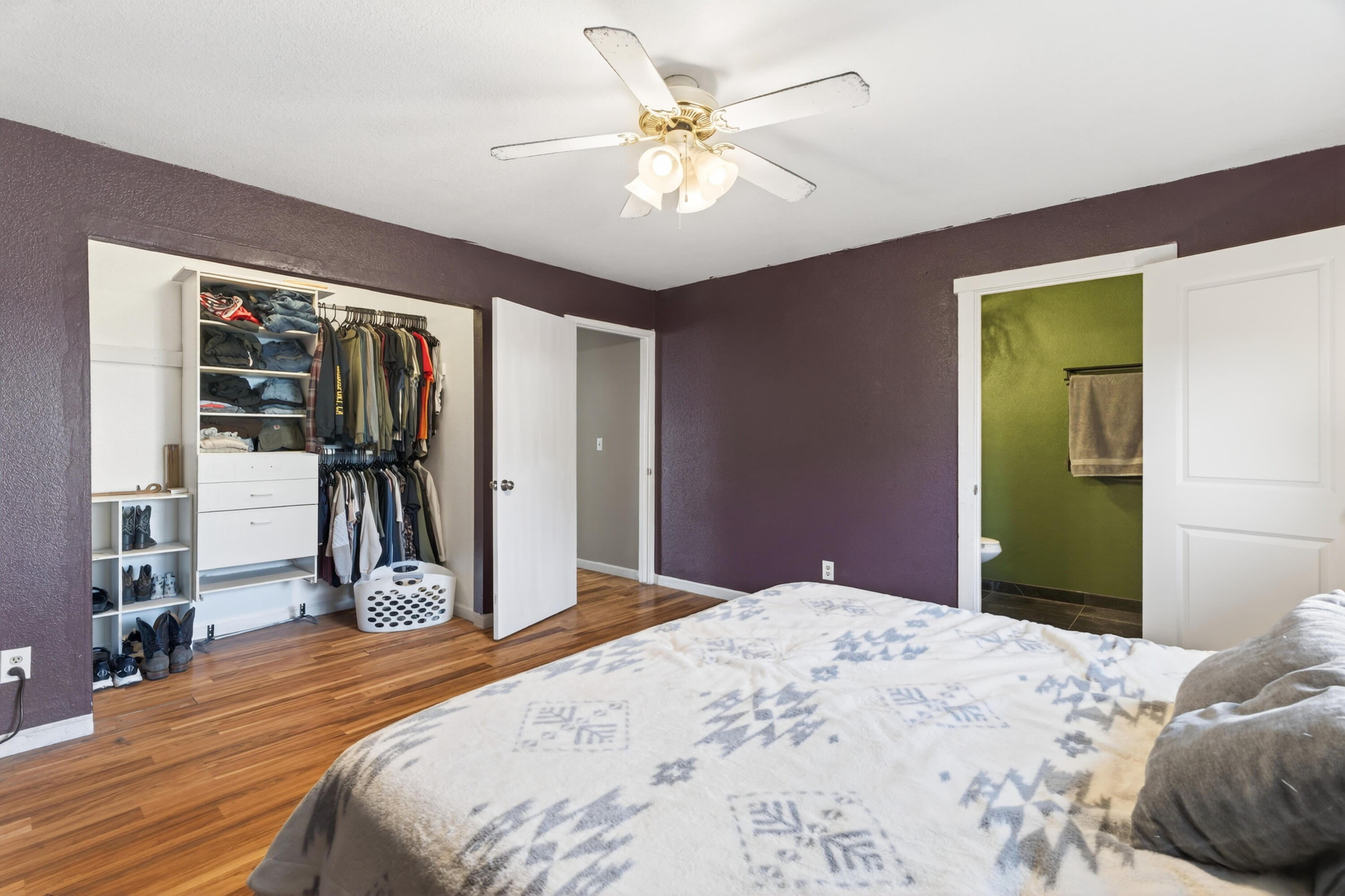 3733 Capricorn Way Redding, CA 96002 - Photo 15 of 22 a bedroom with a bed and a chandelier