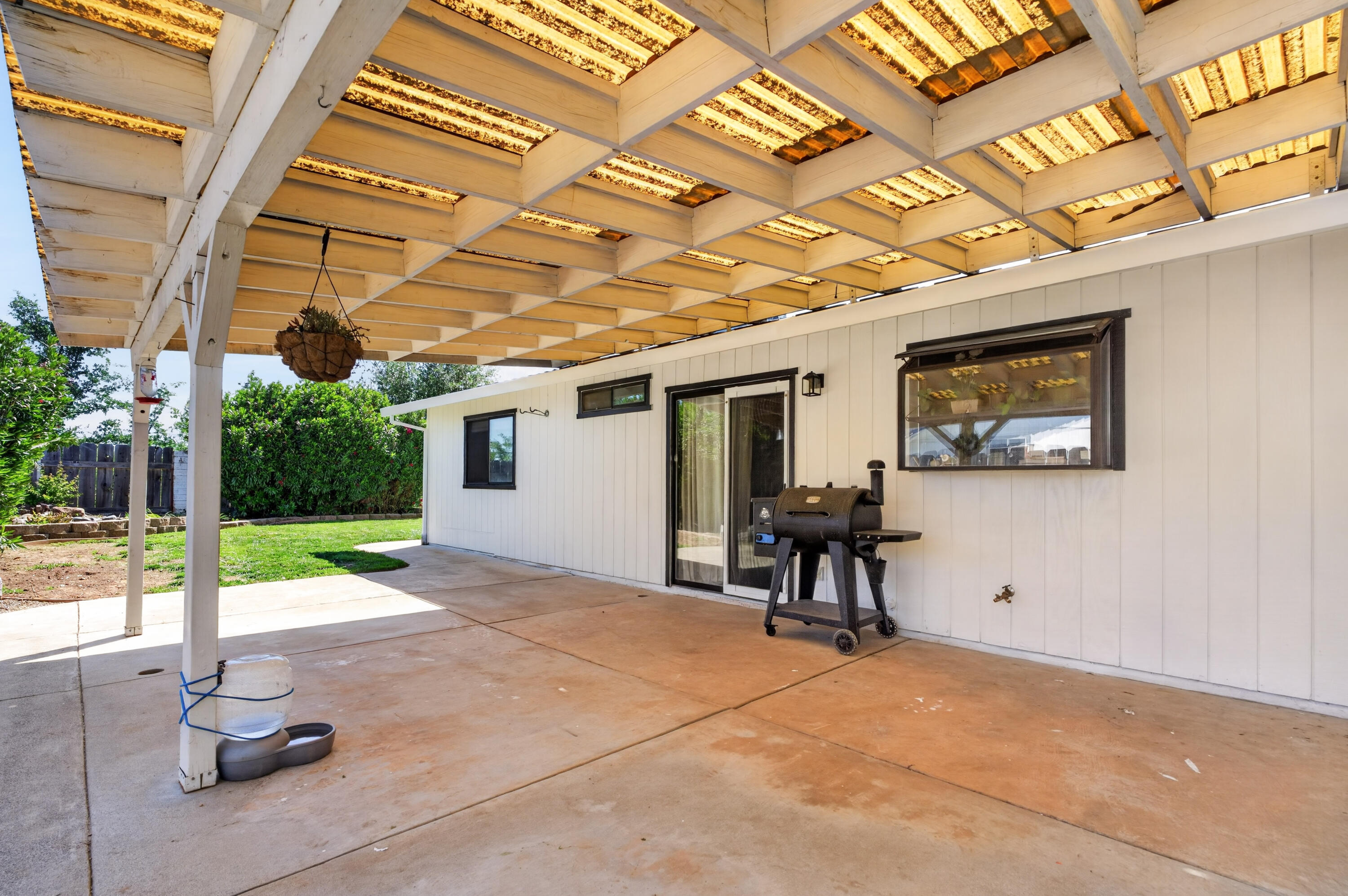 3733 Capricorn Way Redding, CA 96002 - Photo 17 of 22 a view of a porch with furniture and a yard