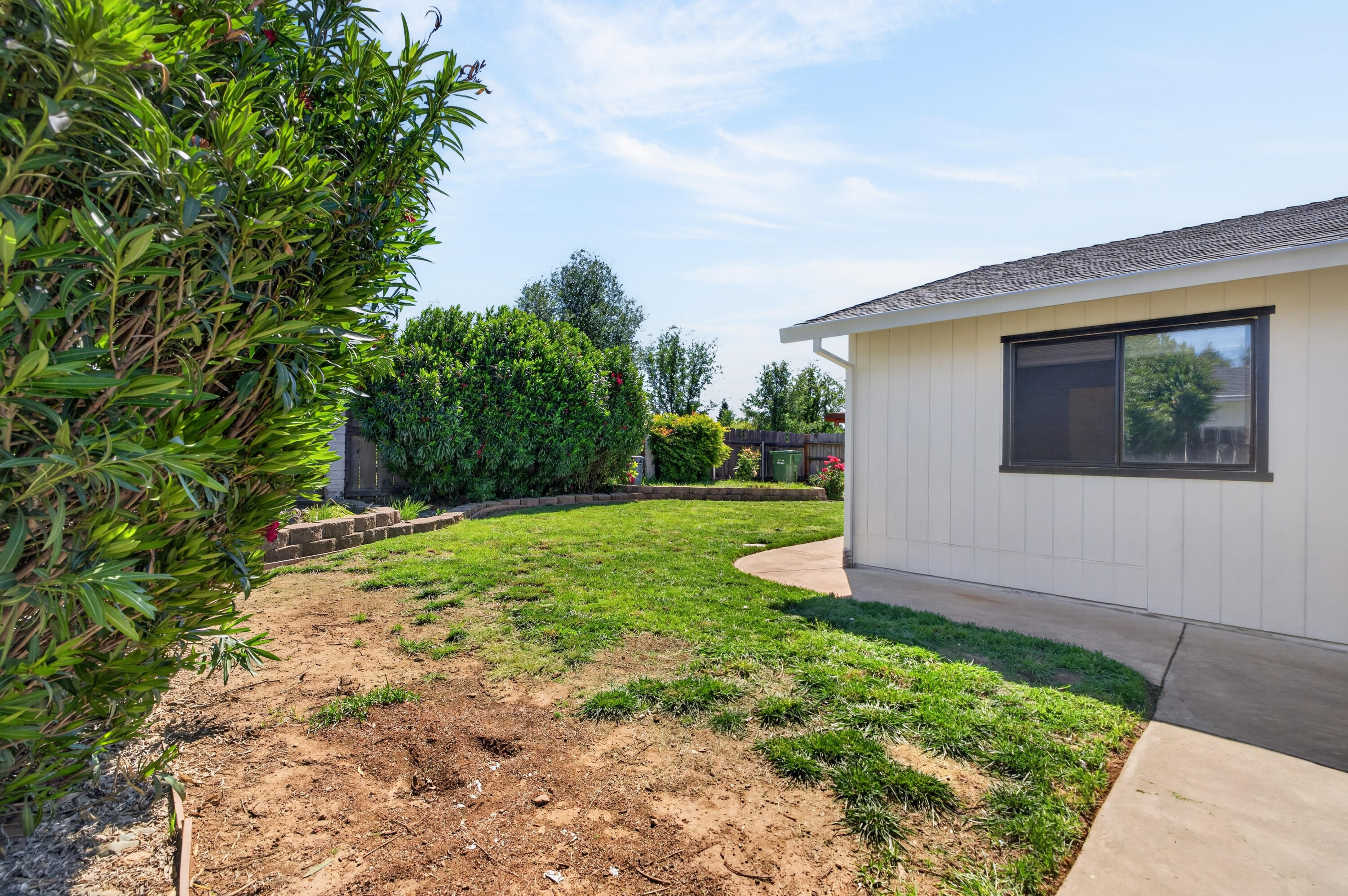 3733 Capricorn Way Redding, CA 96002 - Photo 19 of 22 a front view of a house with garden