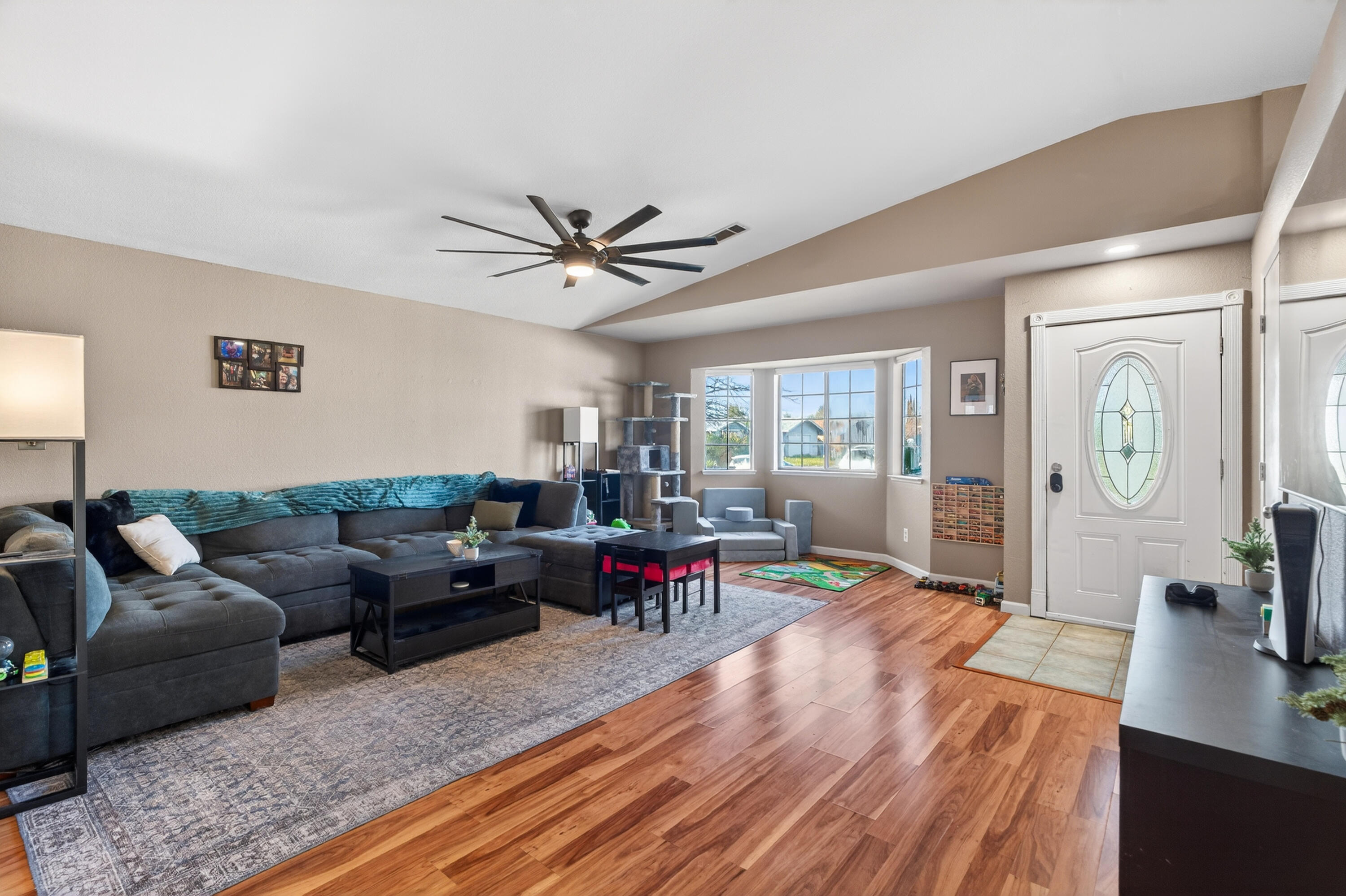3733 Capricorn Way Redding, CA 96002 - Photo 6 of 22 a living room with furniture and a flat screen tv