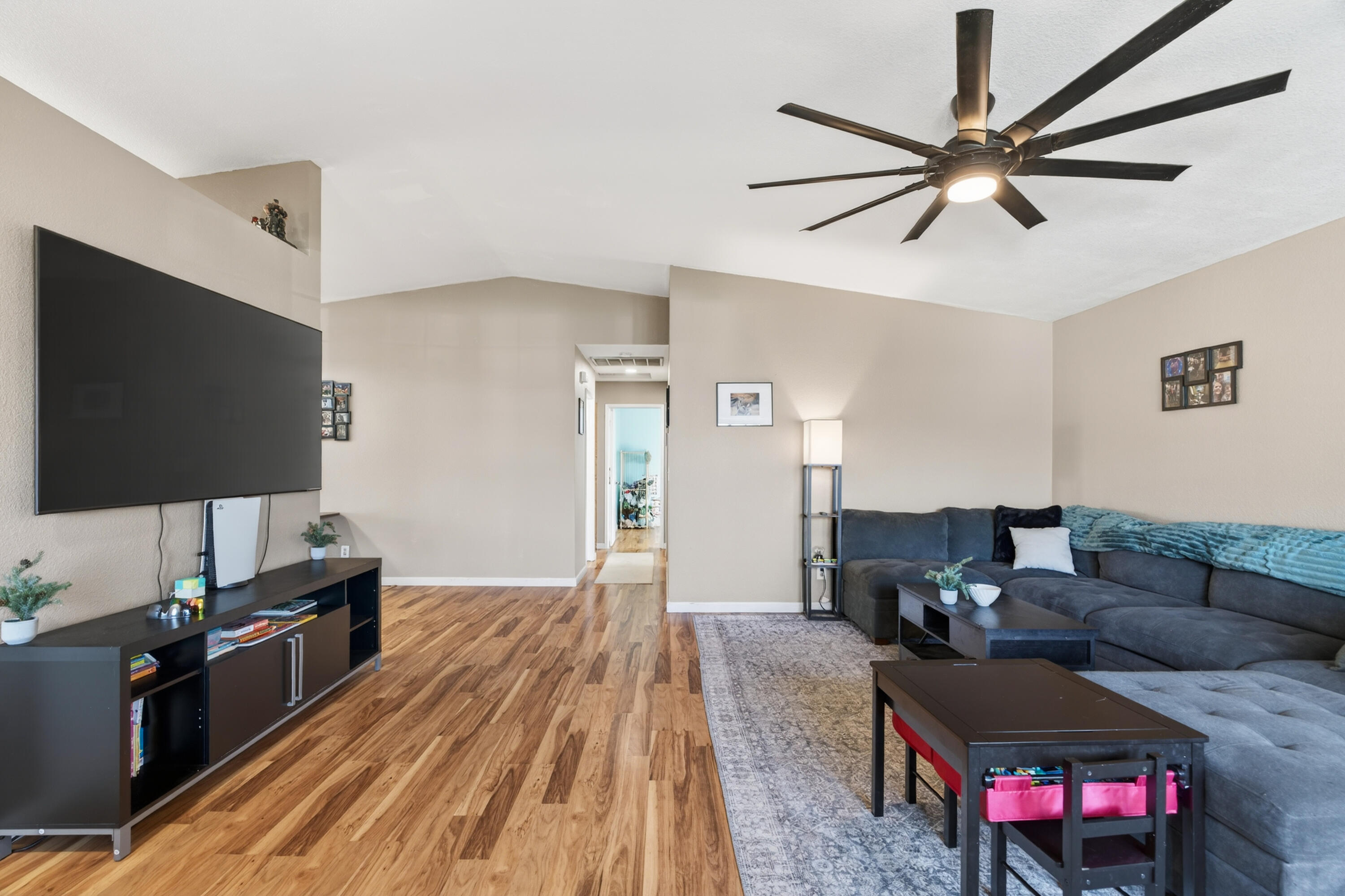 3733 Capricorn Way Redding, CA 96002 - Photo 7 of 22 a living room with furniture and a flat screen tv