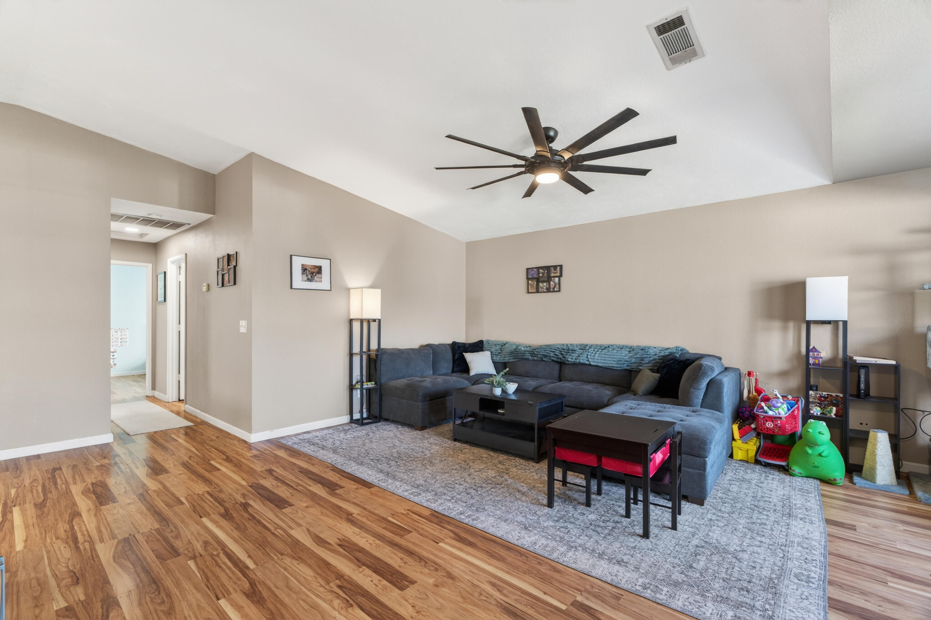 3733 Capricorn Way Redding, CA 96002 - Photo 8 of 22 a living room with furniture and a wooden floor