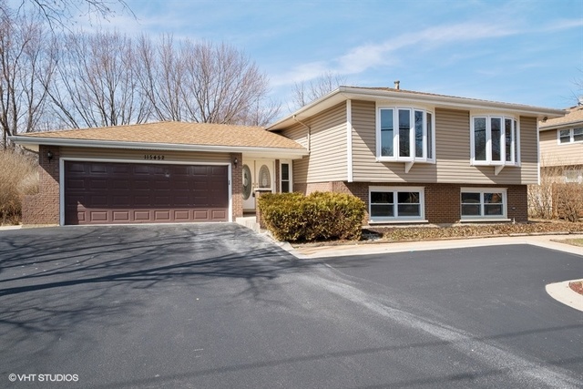 11S452 Book Road Naperville, IL 60564 - Photo 1 of 25 a front view of a house with a yard