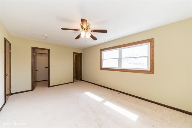 11S452 Book Road Naperville, IL 60564 - Photo 5 of 25 a view of an empty room with a window