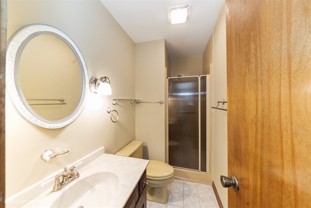 11S452 Book Road Naperville, IL 60564 - Photo 6 of 25 a bathroom with a sink and a mirror