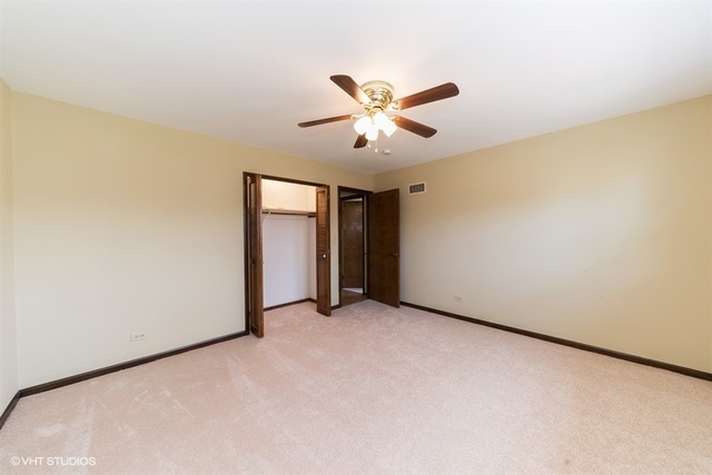 11S452 Book Road Naperville, IL 60564 - Photo 8 of 25 a view of a big room with carpet
