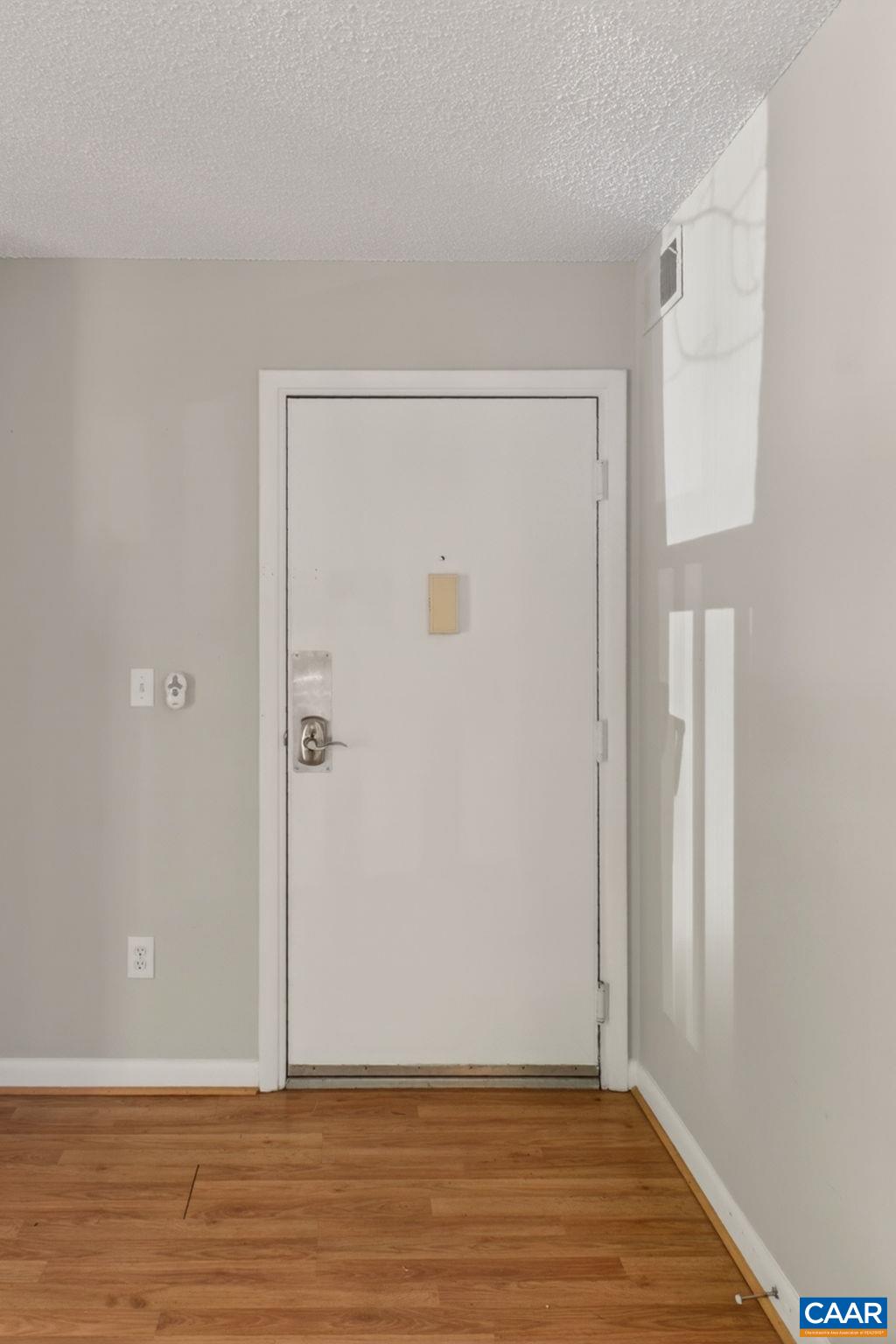 103 Turtle Creek Road, Unit 8 Charlottesville, VA 22901 - Photo 4 of 37 a view of an empty room with wooden floor