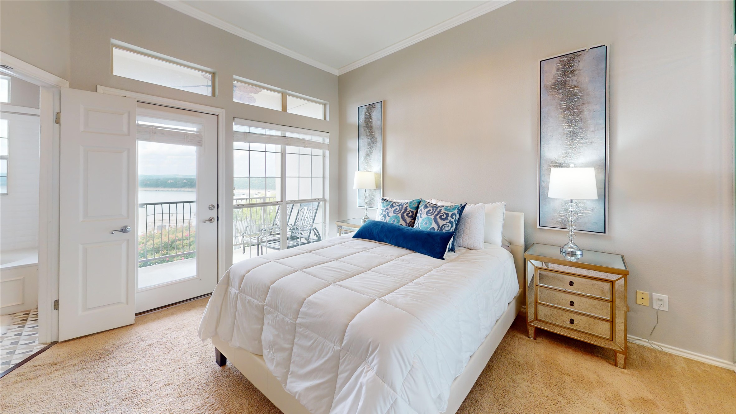 2918 Ranch Road 620, Unit 297 Austin, TX 78734 - Photo 16 of 37 Bedroom featuring ornamental molding, access to outside, light colored carpet, and a water view