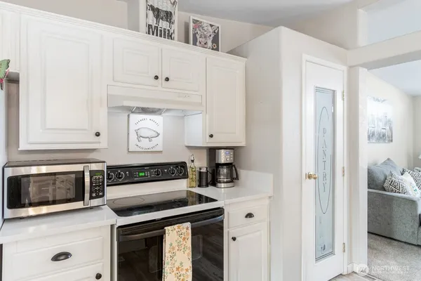 a kitchen with cabinets and appliances