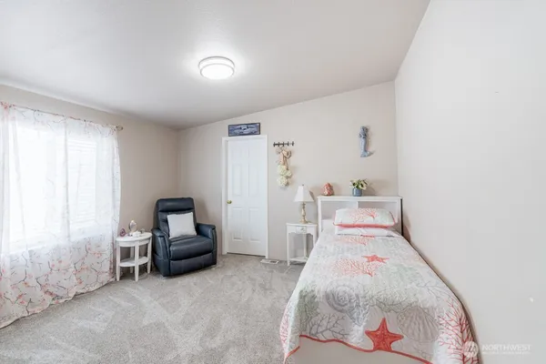a bedroom with furniture and a bed