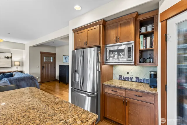 a kitchen with a refrigerator and cabinets