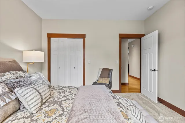 a bedroom with a bed and a lamp