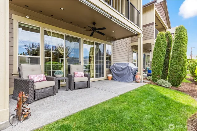 a bedroom with furniture and a large window