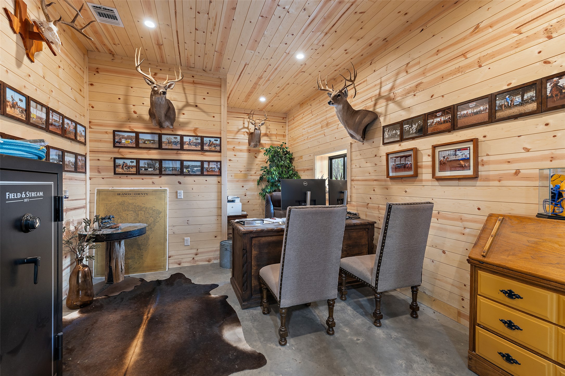 3431 Klett Ranch Road Johnson City, TX 78636 - Photo 16 of 33 Dining area featuring wooden walls, concrete flooring, a desk, recessed lighting, and wood ceiling