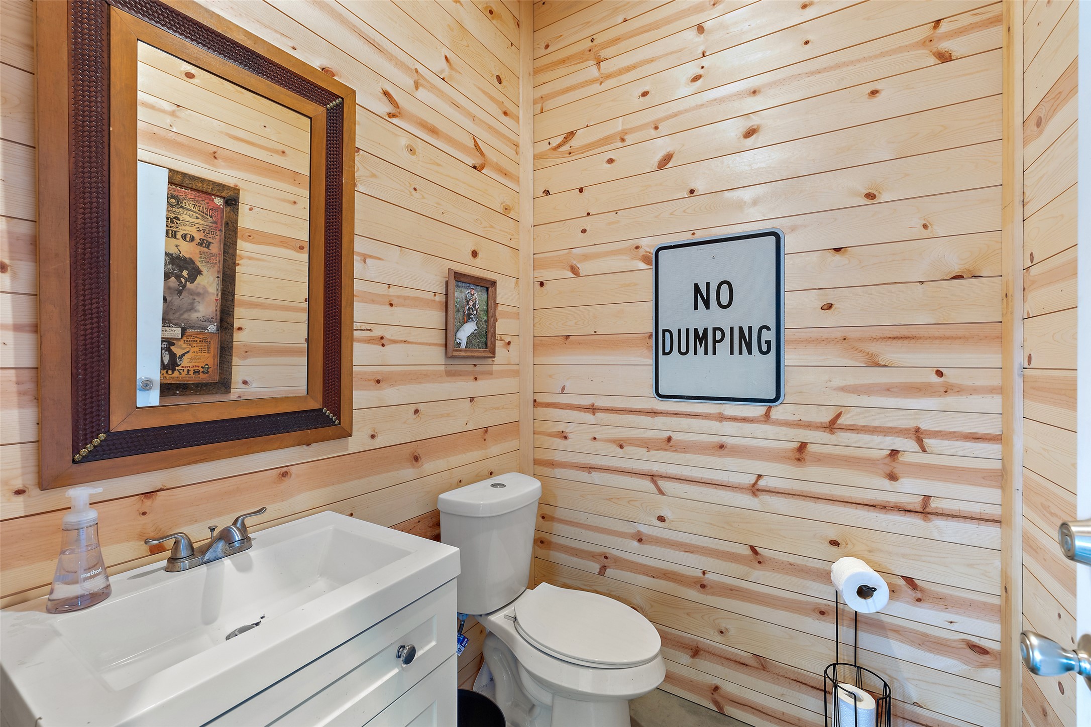 3431 Klett Ranch Road Johnson City, TX 78636 - Photo 17 of 33 Bathroom with wood walls and vanity
