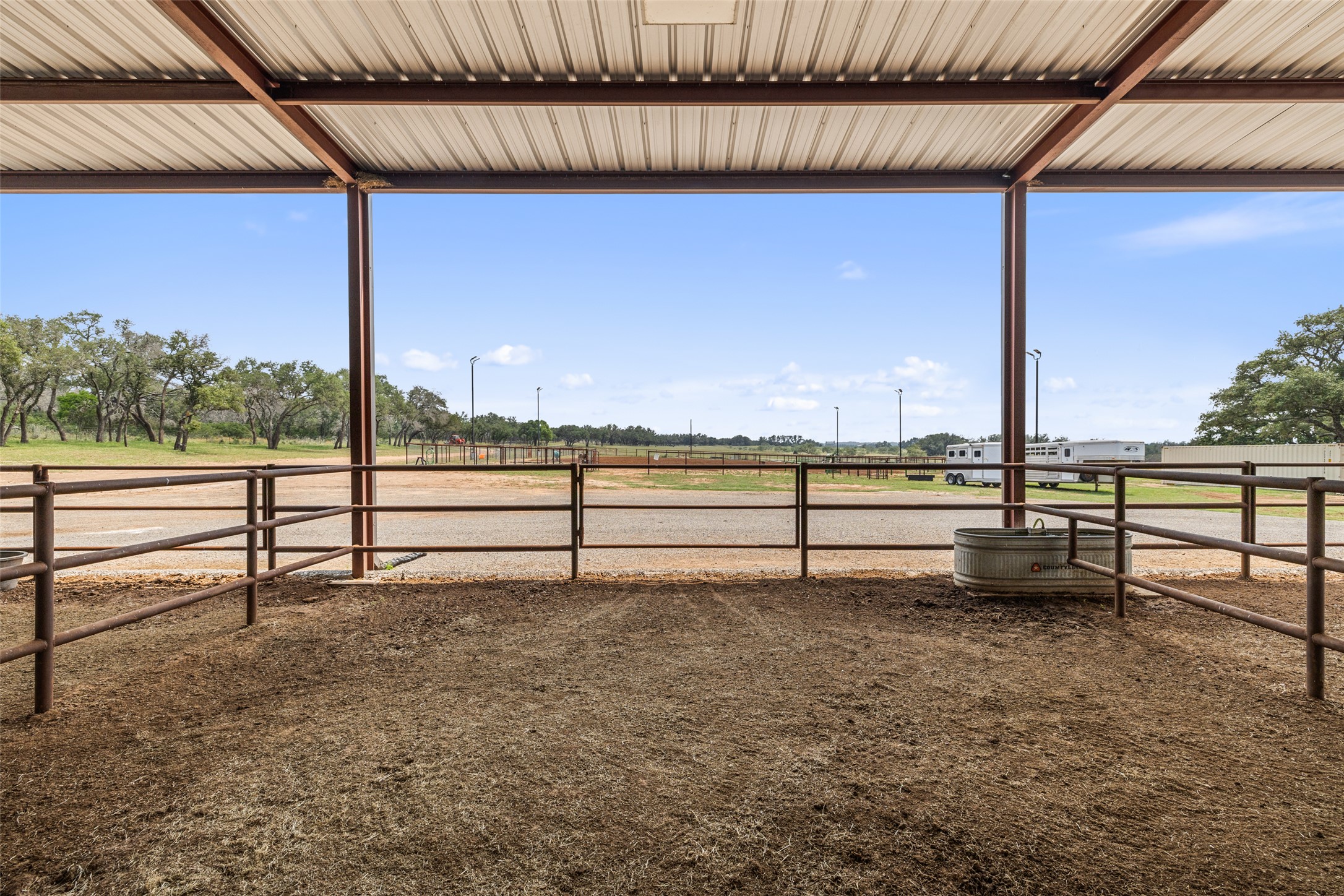 3431 Klett Ranch Road Johnson City, TX 78636 - Photo 20 of 33 View of yard featuring an outbuilding, an exterior structure, and a view of rural / pastoral area