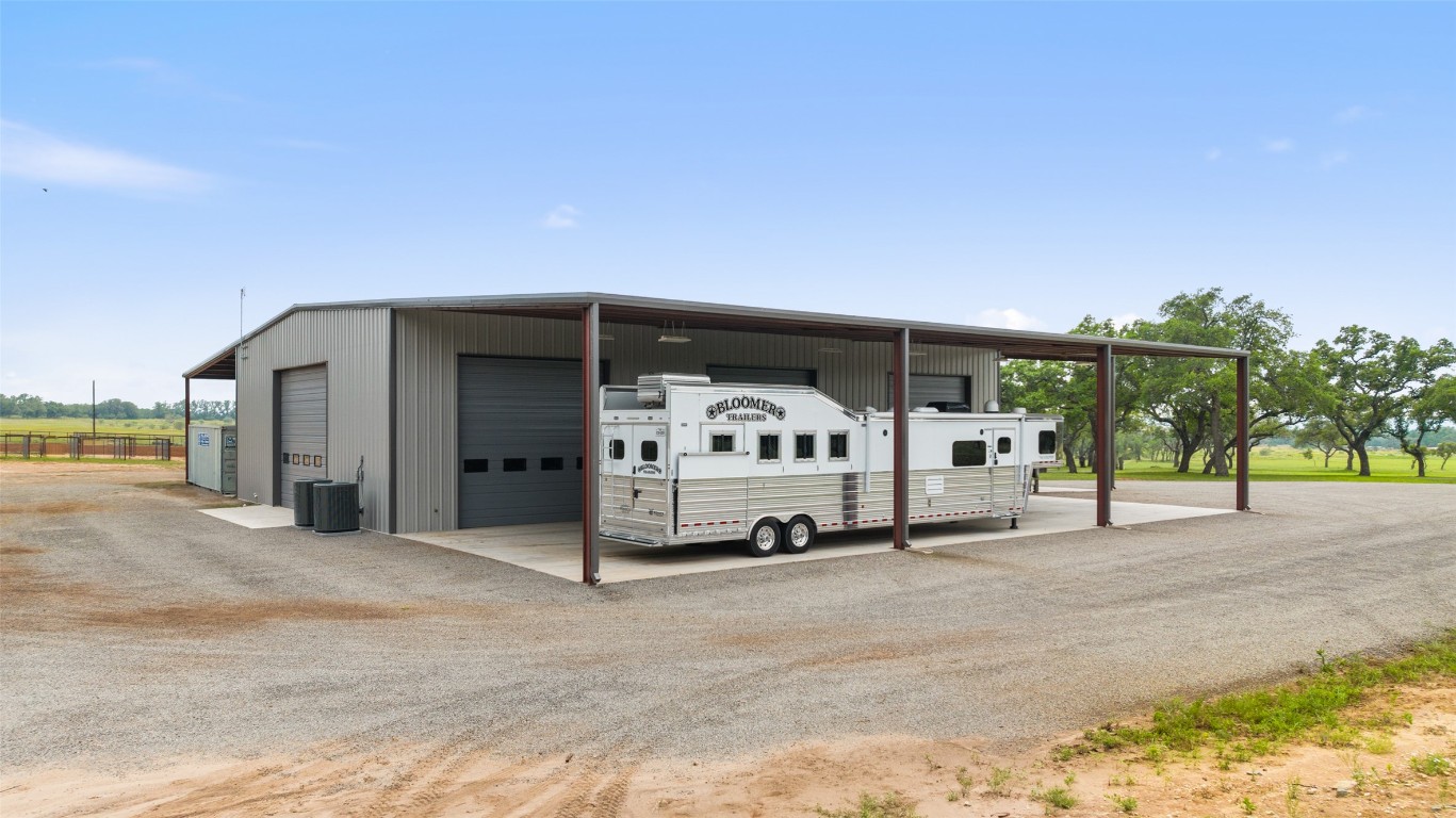 3431 Klett Ranch Road Johnson City, TX 78636 - Photo 10 of 33 a car parked in front of a building