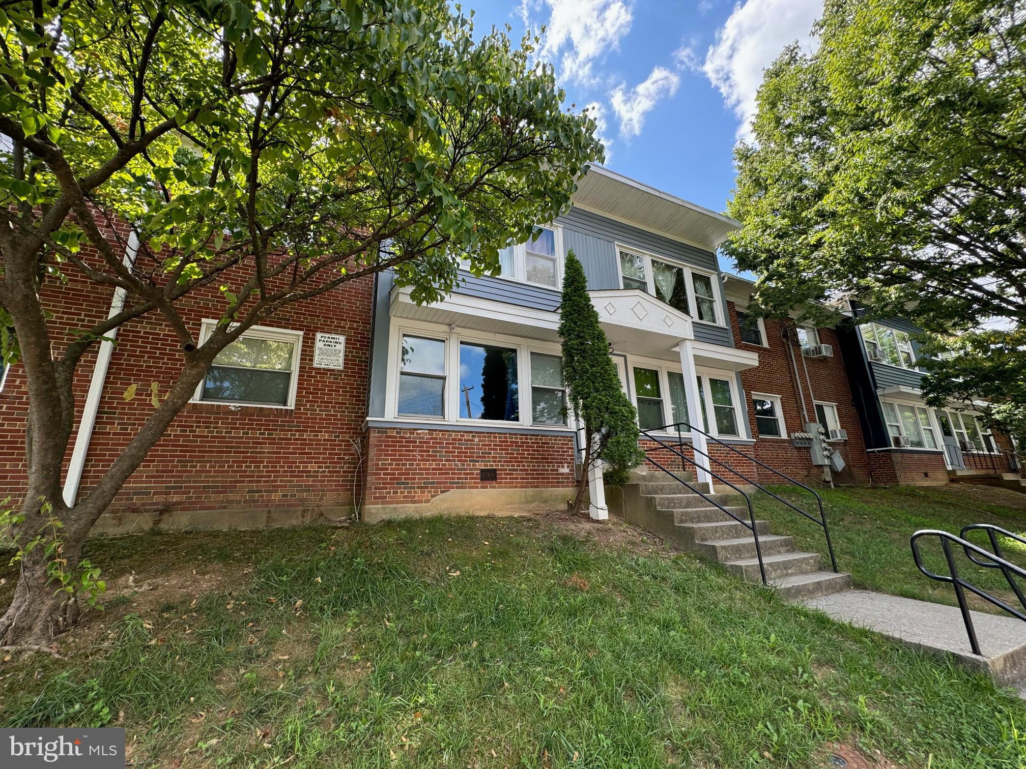 1015 Quebec Terrace Silver Spring, MD 20903 - Photo 2 of 13 a view of a brick house with a yard