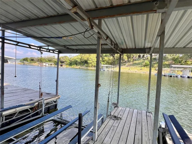 a view of a balcony with wooden floor