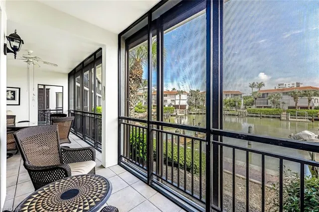 a view of a living room and a balcony