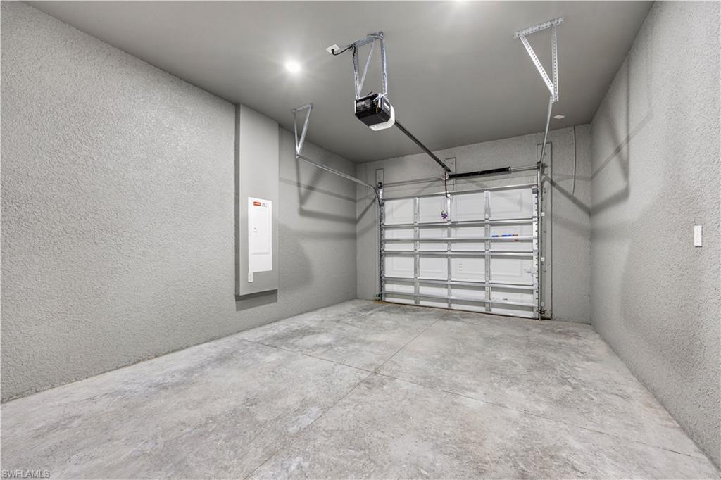 1217 Cellini Street East Lehigh Acres, FL 33974 - Photo 21 of 23 a view of a garage