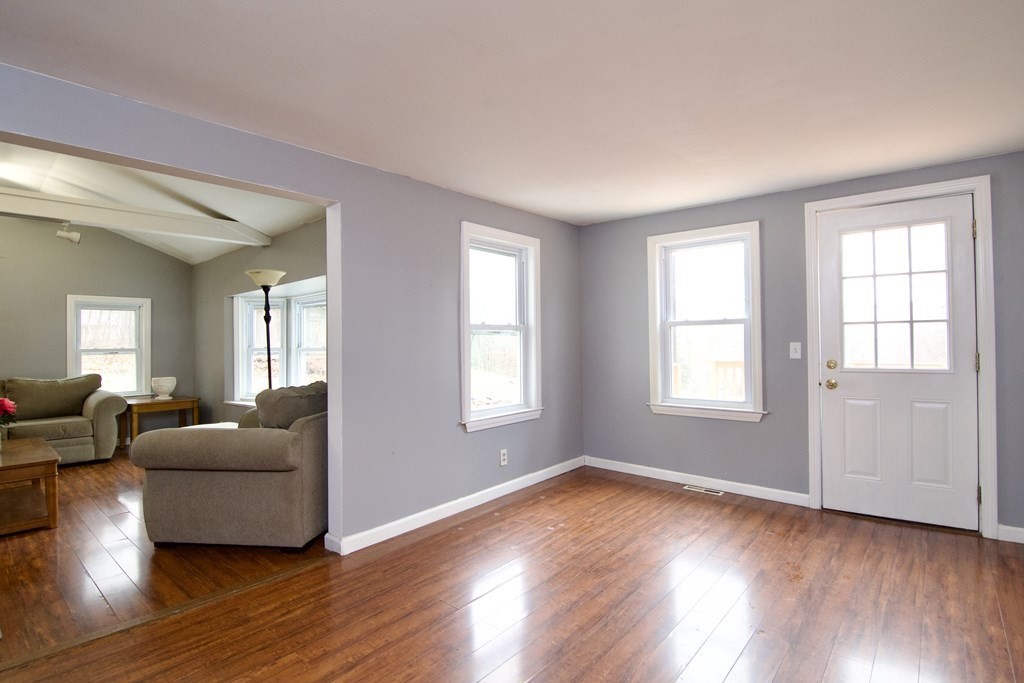 338 Wilbraham Road Hampden, MA 01036 - Photo 13 of 42 a living room with couches and potted plants with wooden floor