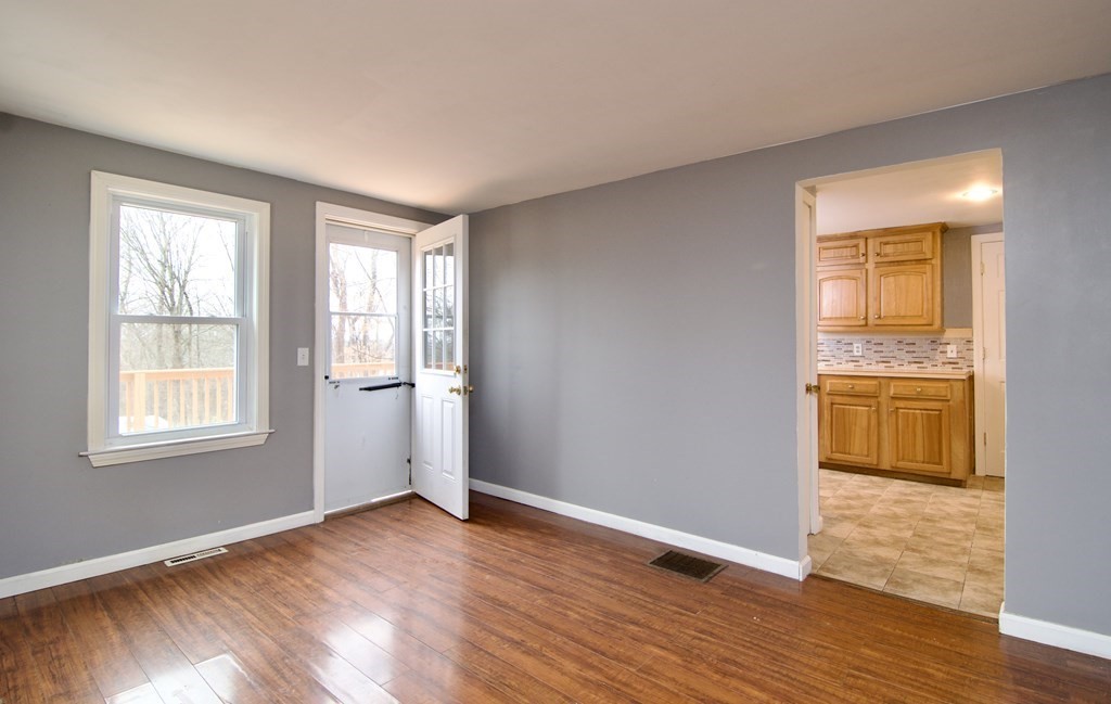 338 Wilbraham Road Hampden, MA 01036 - Photo 19 of 42 a view of an empty room with wooden floor and a window