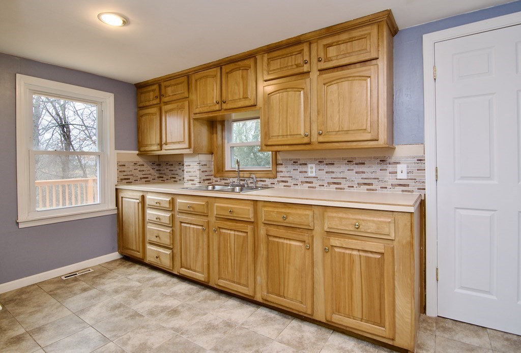 338 Wilbraham Road Hampden, MA 01036 - Photo 20 of 42 a kitchen with granite countertop cabinets and window