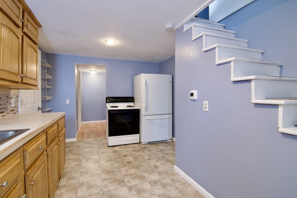 338 Wilbraham Road Hampden, MA 01036 - Photo 22 of 42 a kitchen with a refrigerator and a sink
