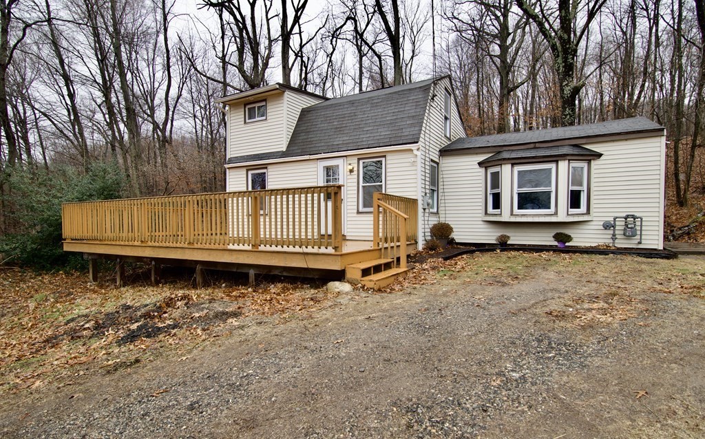 338 Wilbraham Road Hampden, MA 01036 - Photo 3 of 42 a front view of a house with a yard and wooden fence