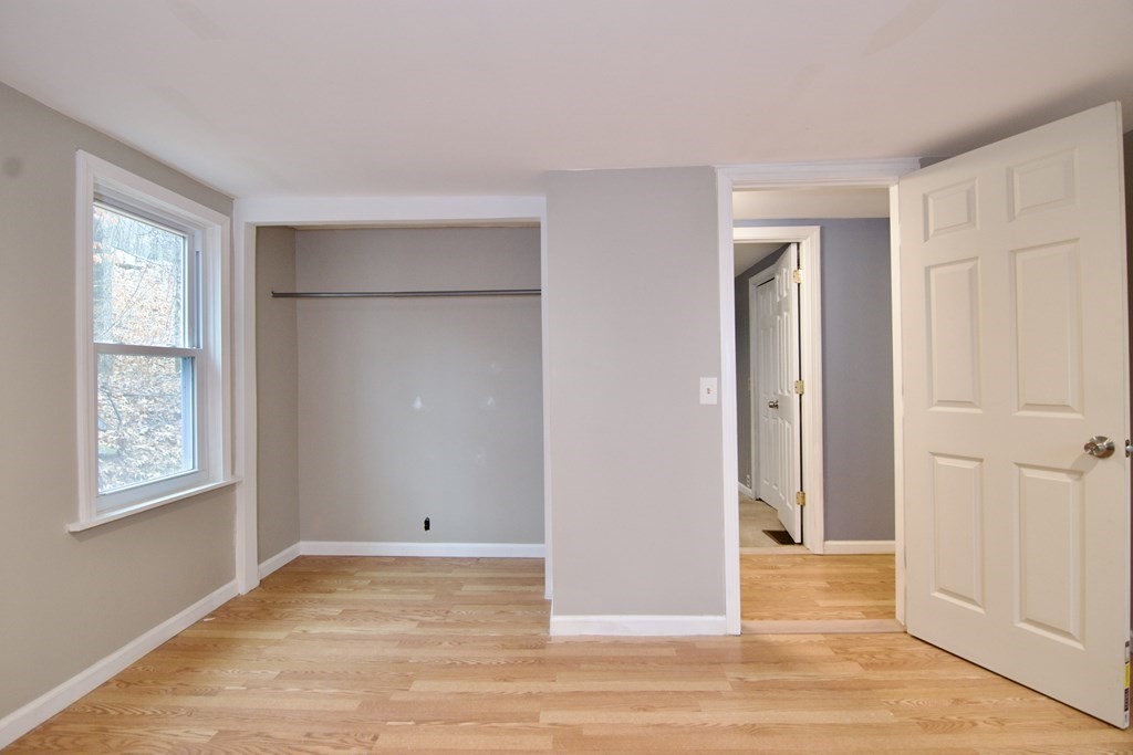 338 Wilbraham Road Hampden, MA 01036 - Photo 32 of 42 a view of an empty room with wooden floor and a window