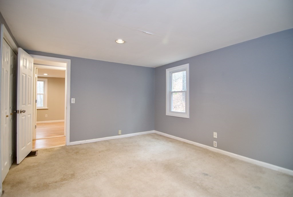338 Wilbraham Road Hampden, MA 01036 - Photo 37 of 42 a view of an empty room with closet and a window