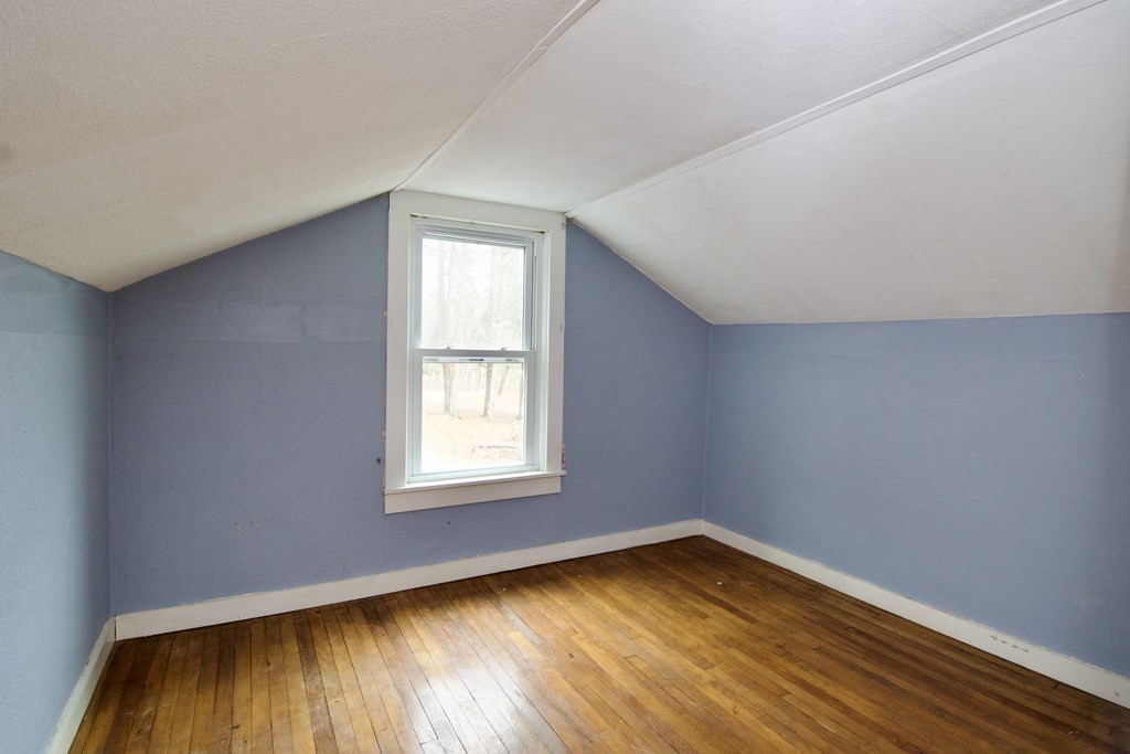 338 Wilbraham Road Hampden, MA 01036 - Photo 39 of 42 an empty room with wooden floor and windows
